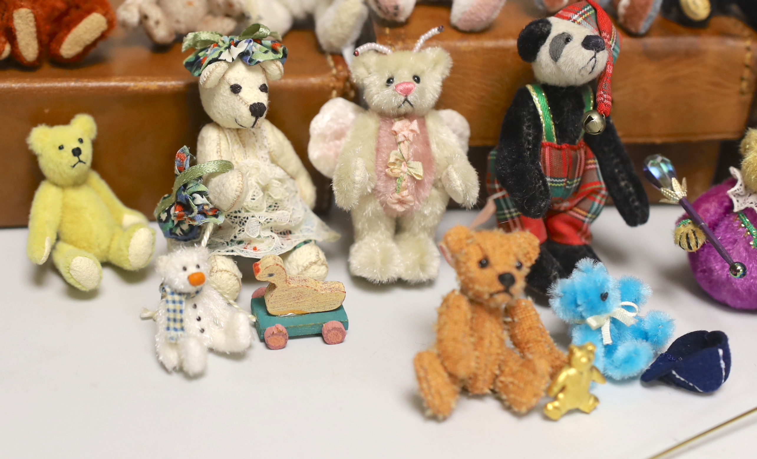 Twenty two miniature Artist bears, assorted teddy bear badges and three teddy bear brooches